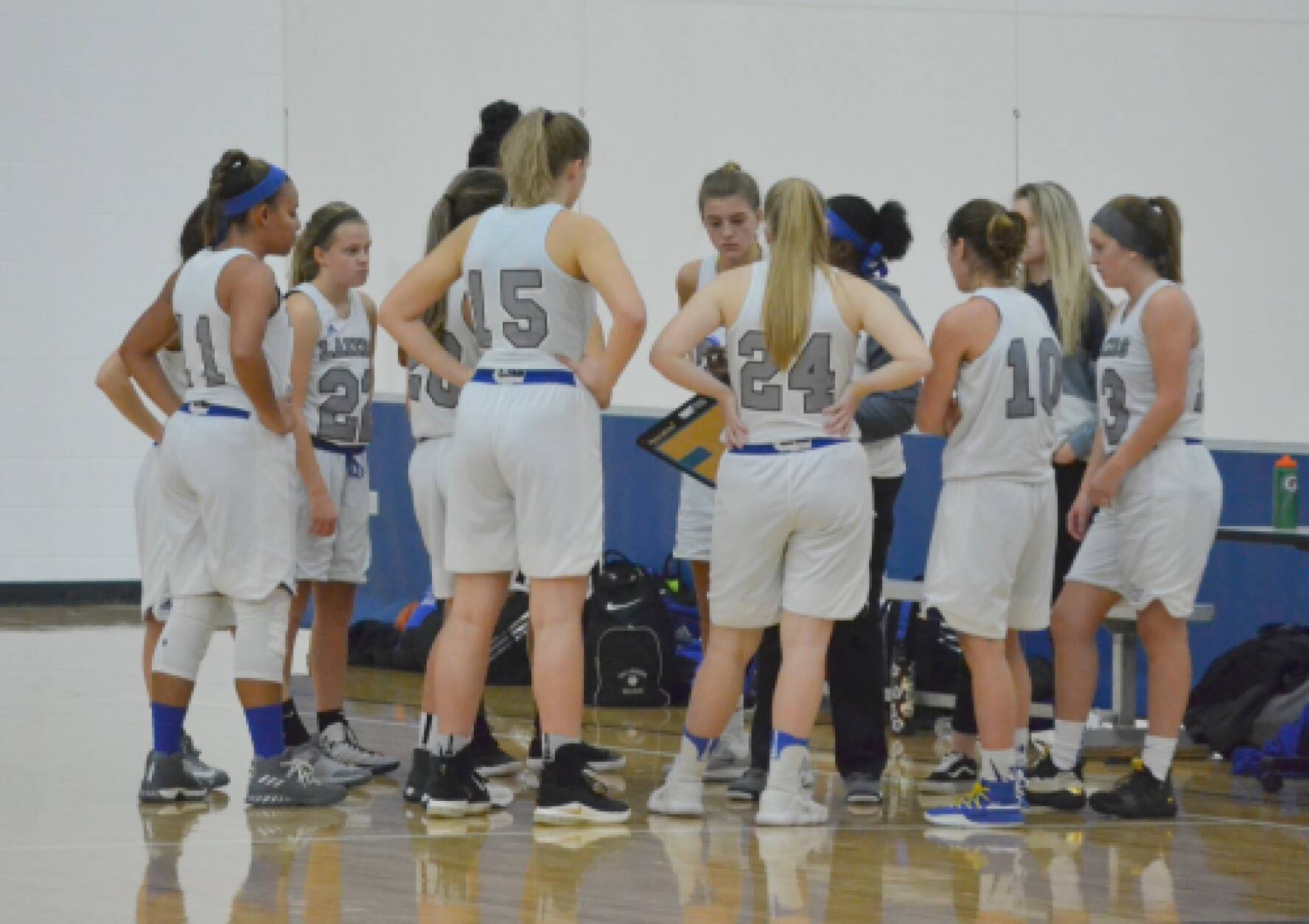 Women's Basketball club attends game timeout during tournament at Ohio State University.